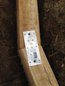 Two pieces of timber attached with a metal tie plate