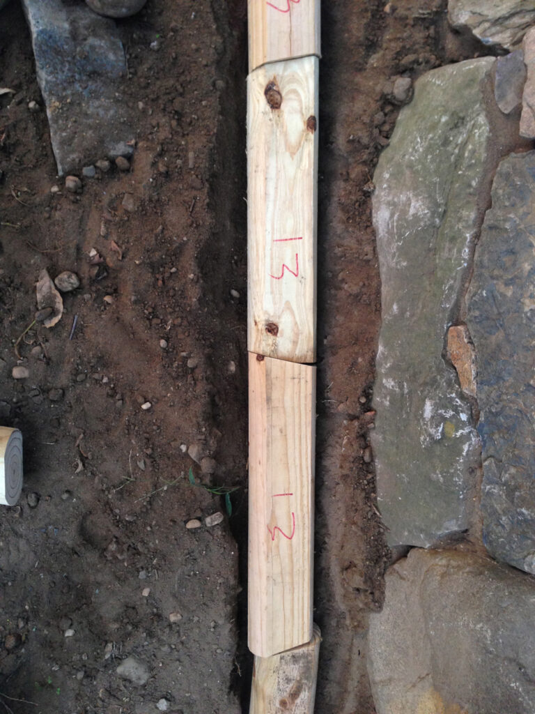 Timber pieces in a trench