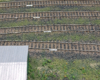 White pieces of styrene laid against the web of the track identify track numbers in a railroad yard.