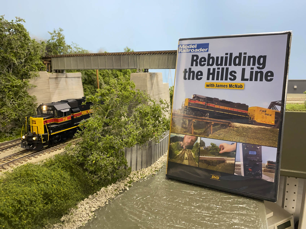 A DVD case next to an HO scale diesel locomotive