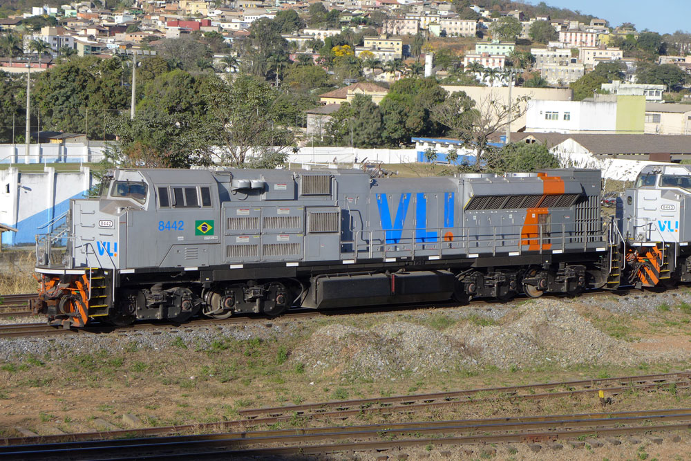 silver locomotive sitting on tracks in Brazil