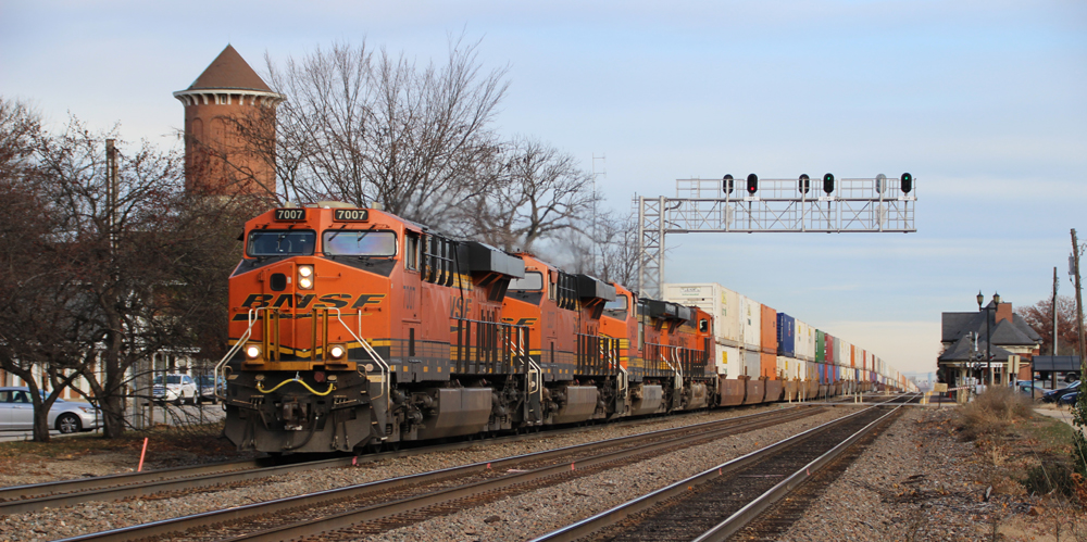 Intermodal train with orange locomotives