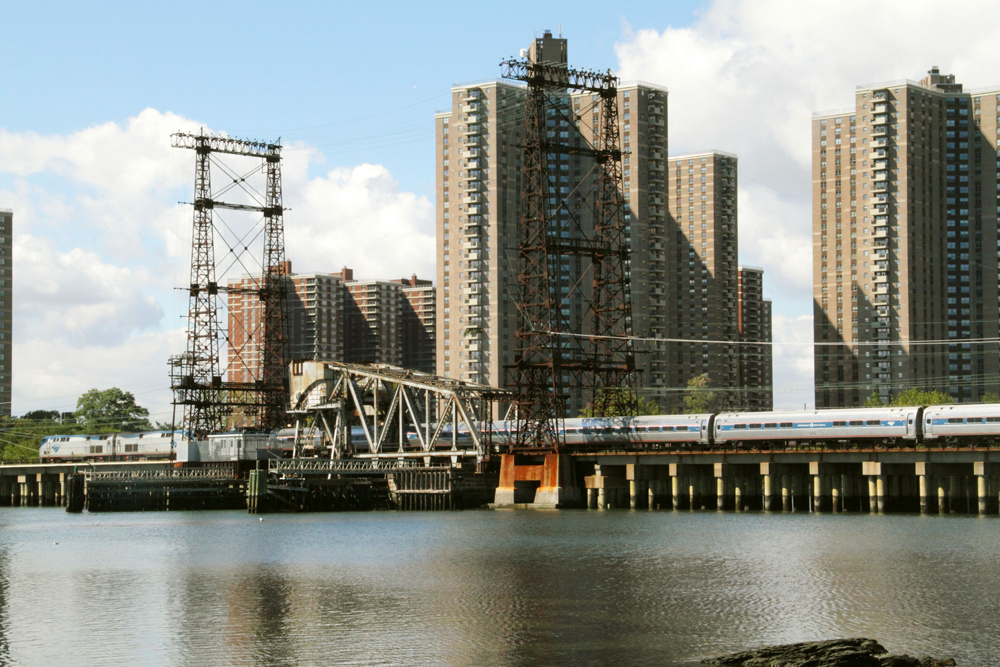 Passenger train crosses bridge