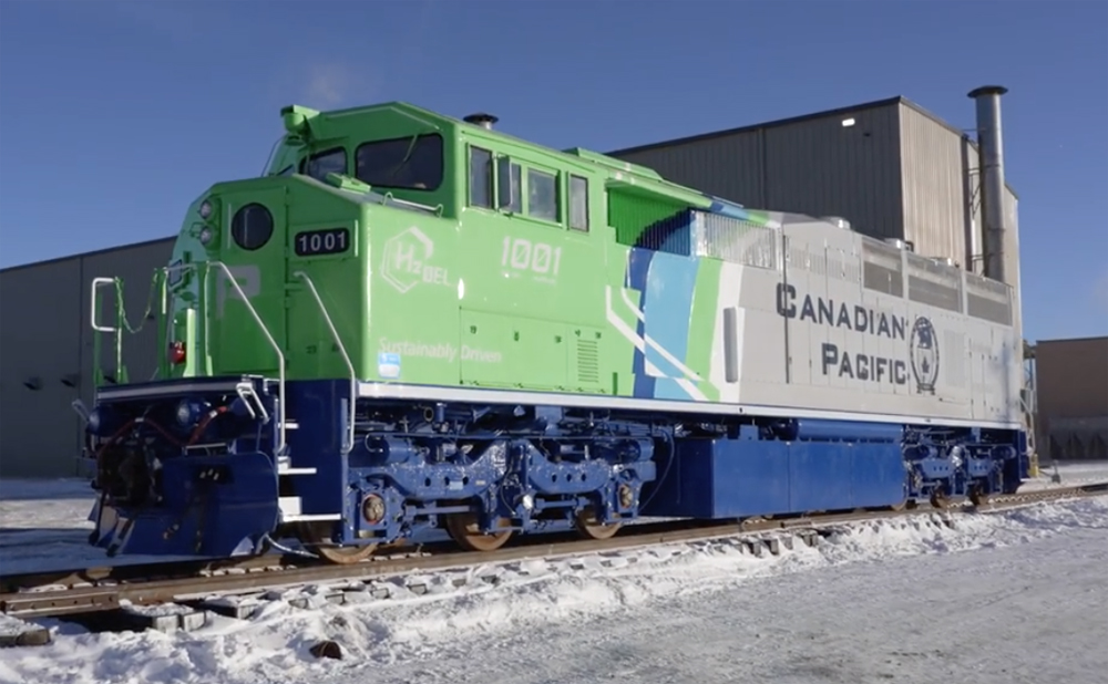 Green and gray cowl locomotive with blue trim