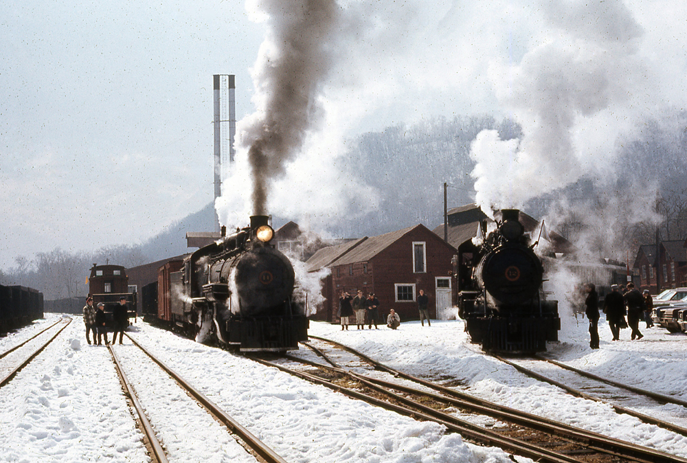 Two steam locomotives in snow