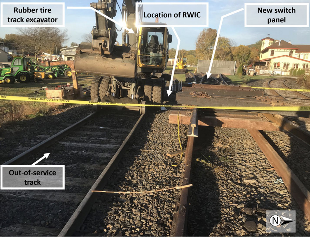 Photo of accident site with track excavator