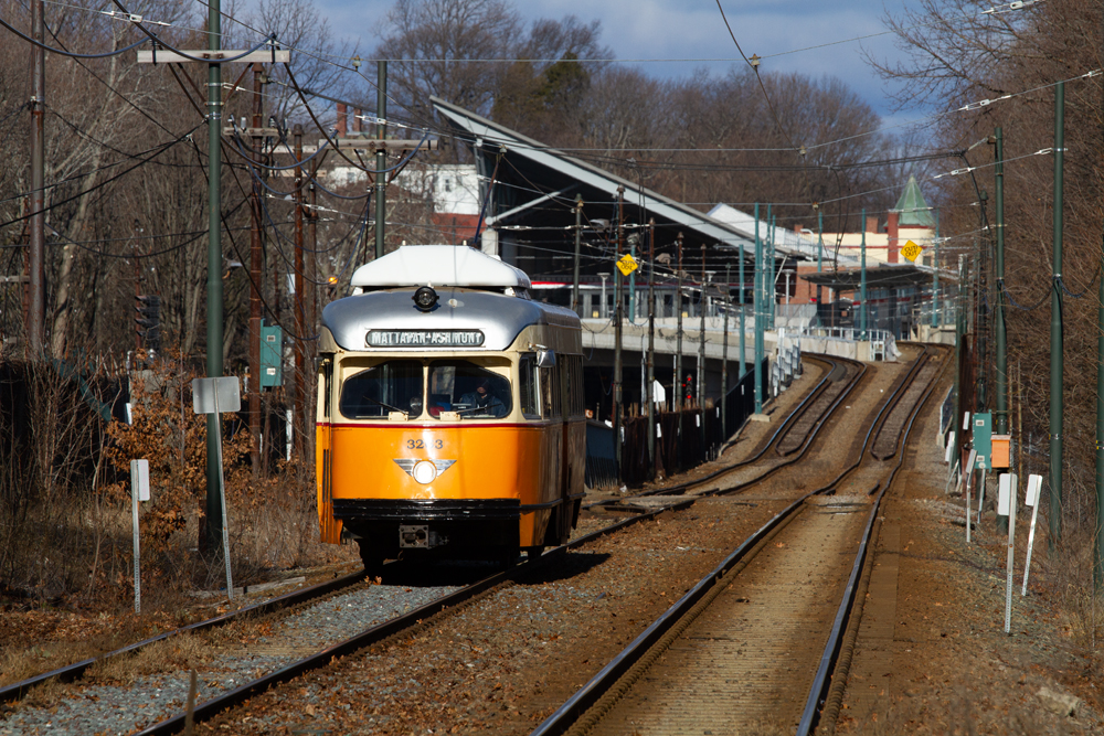 Orange and white PCC trolley car on double track