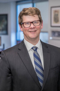 Head-and-shoulders photo of man in suit