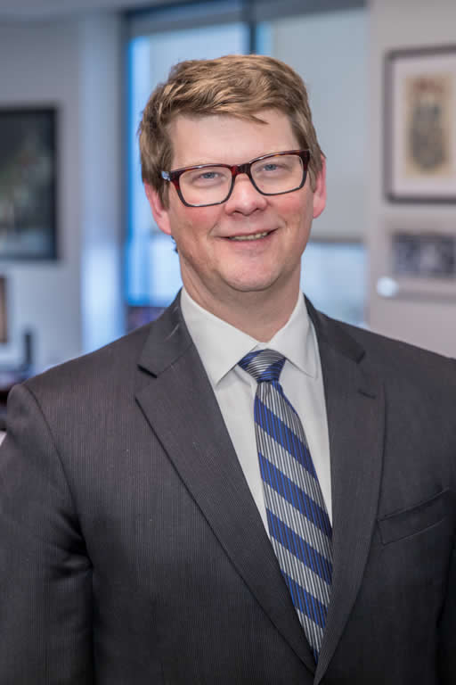 Head-and-shoulders photo of man in suit