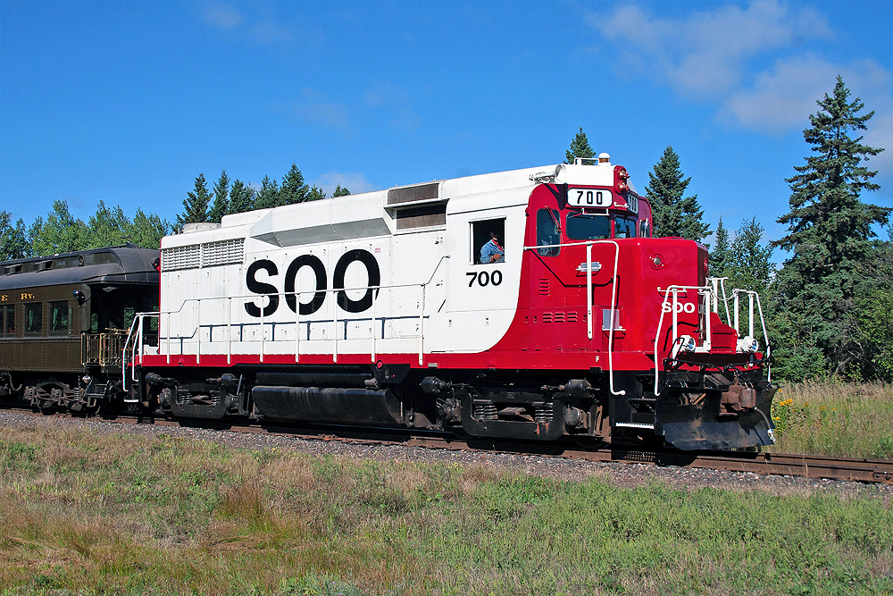 Locomotive in red and white Soo Line paint scheme.