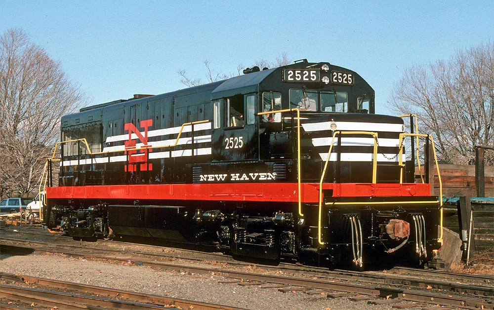 Black locomotive with white stripes and red frame.