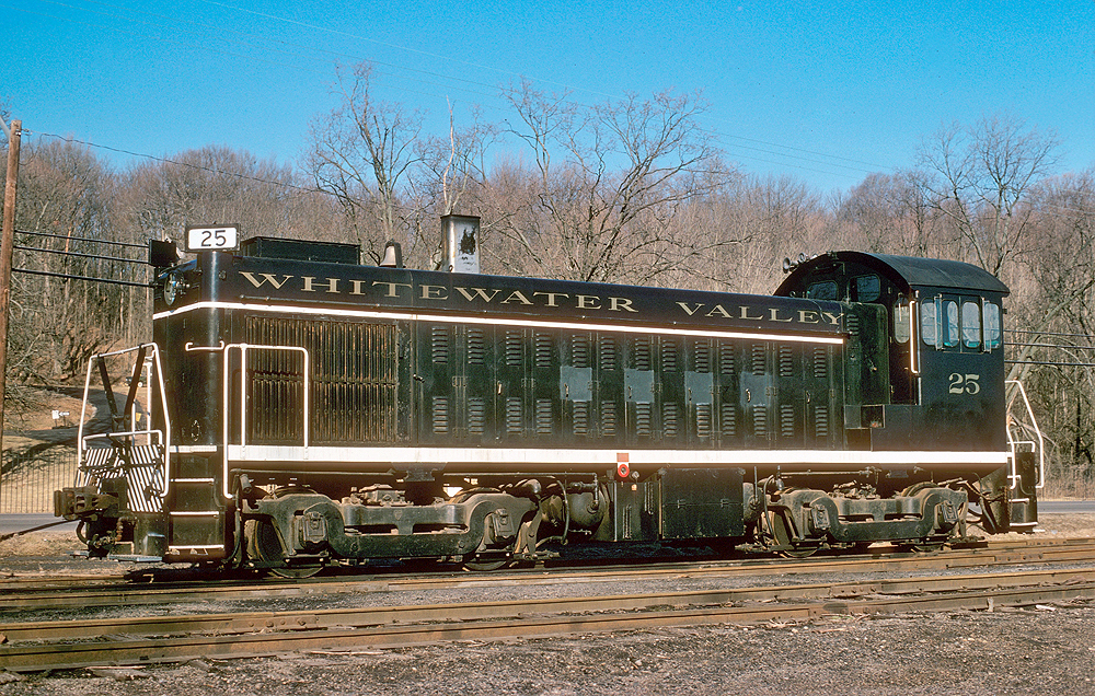 Black end-cab switcher with gold lettering and stripe around long hood.