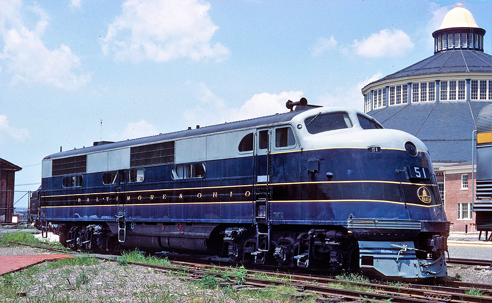 Blue and gray locomotive with gold trim and lettering.