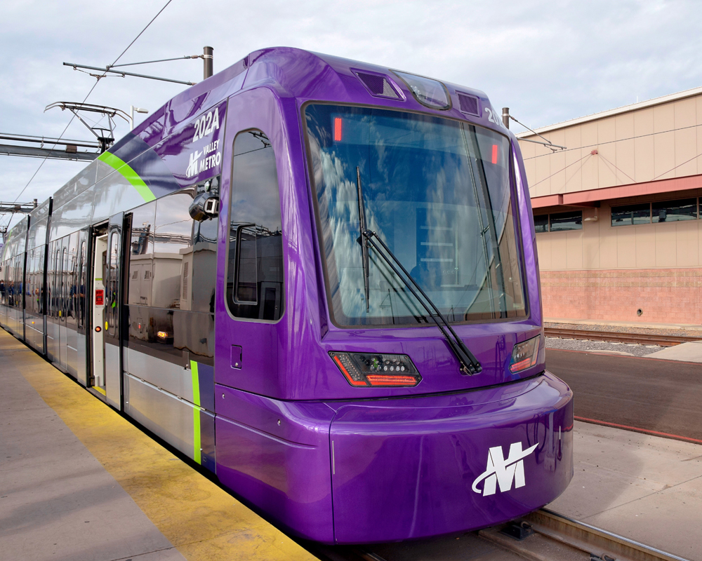 Purple and silver light rail trainset