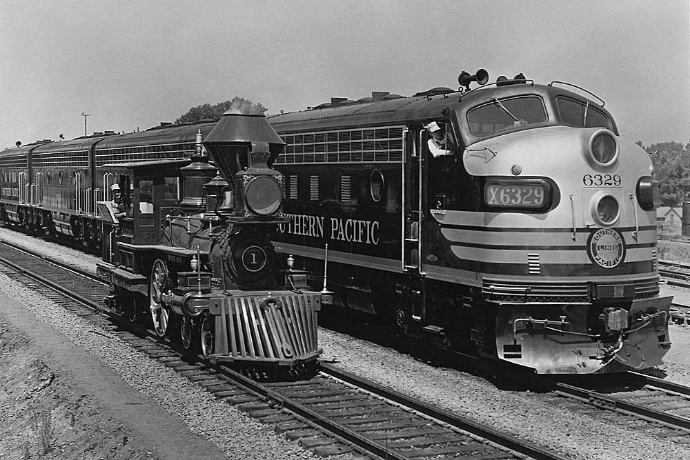 Southern Pacific locomotives: Small steam locomotive rests adjacent to larger streamlined diesel
