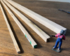 wood pieces next to a model figure