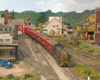 A green-and-yellow diesel pulls a train of red Swift Meats reefers