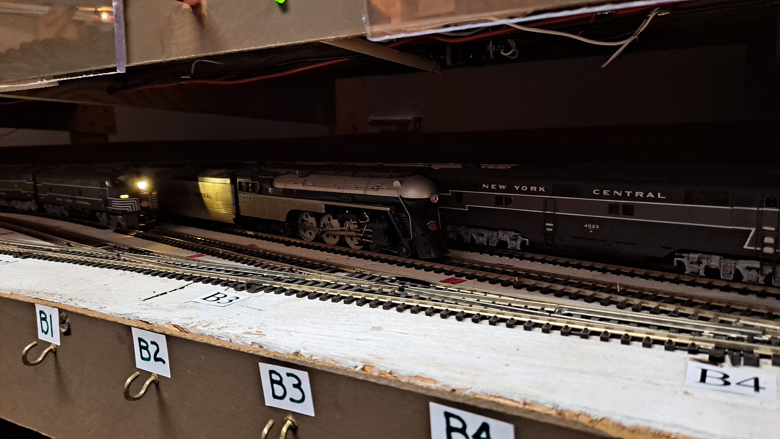 New York Central HO scale trains are lined up in staging.