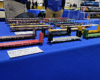 Six bulkhead flatcars stand in front of five TOFC flatcars and four bi-level auto racks.