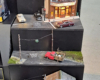 Display stand with street corners showing three types of traffic lights.