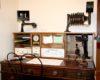 Photo of desk and chair with late 1880s railroad communication equipment.