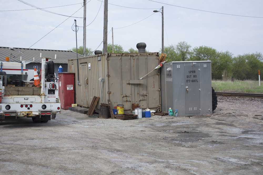 Details to the south of the Jefferson Junction, Wis., station, including an intermodal container, signal bungalow, and flammable liquids cabinet.