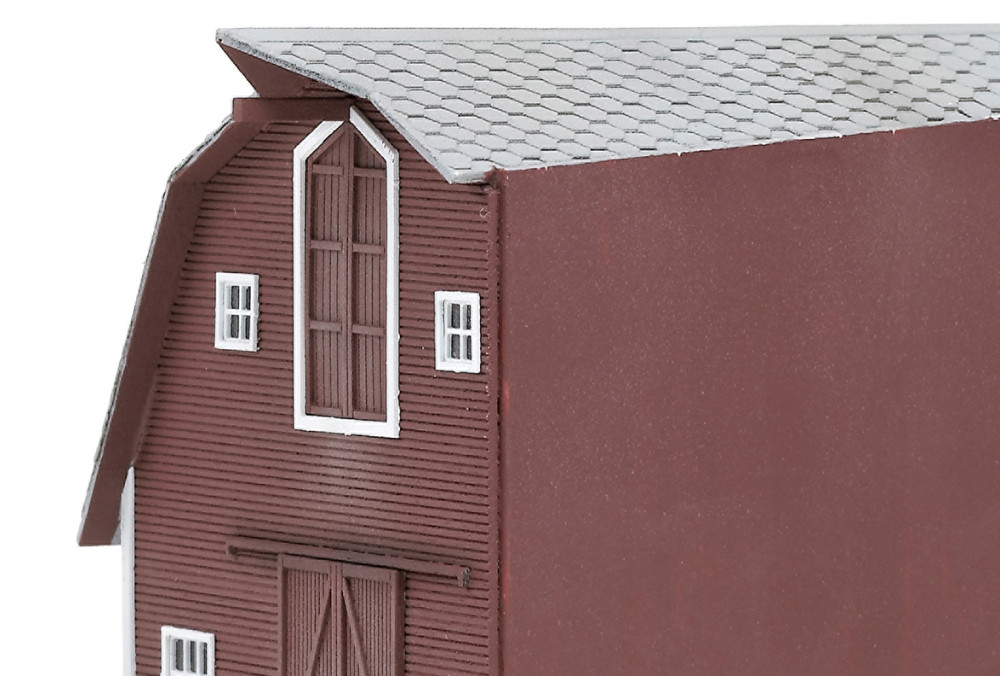 Photo of modified N scale barn kit after painting and weathering.