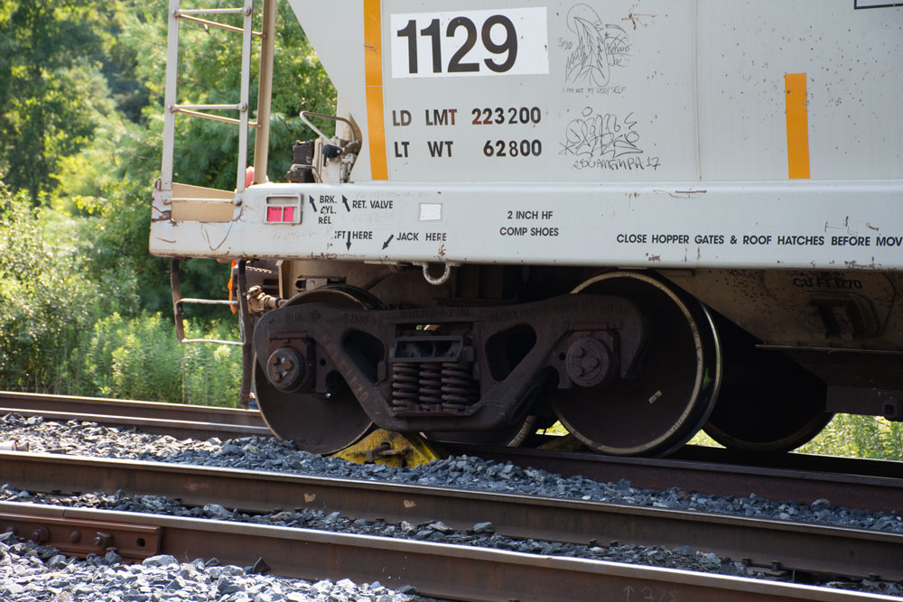 Rear of covered hopper next to wheel ramp