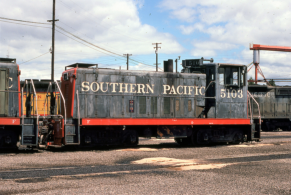 black locomotive with red nose and red at the bottom edge