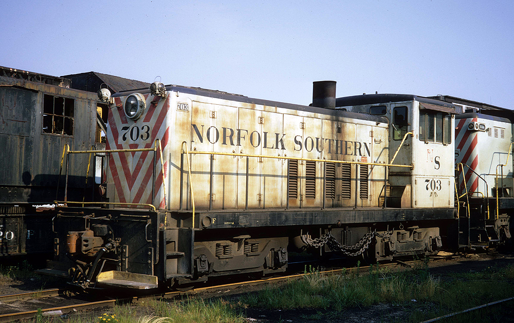 Oddball diesel locomotives: white locomotive with red stripes on front
