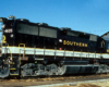 Oddball diesel locomotives: black locomotive with white and gold stripe