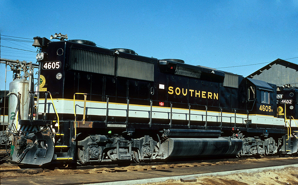 black locomotive with white and gold stripe