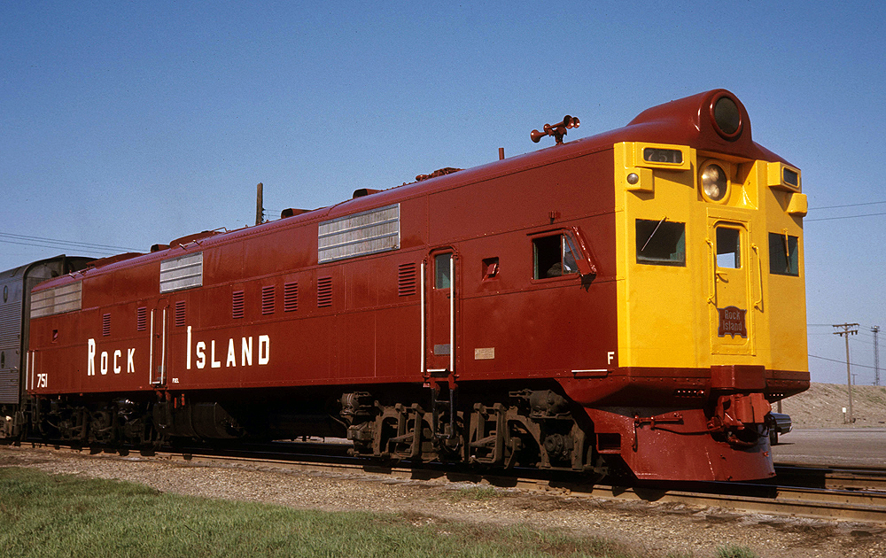 boxy dark red locomotive with flat yellow nose