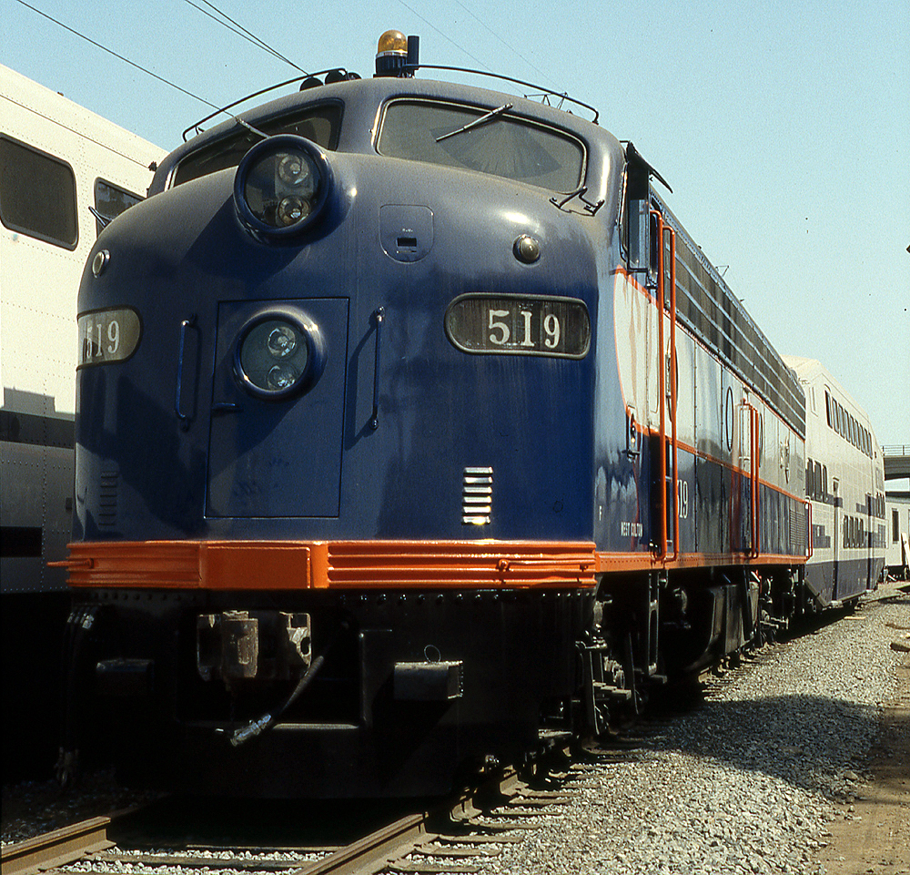 blue locomotive with orange stripe