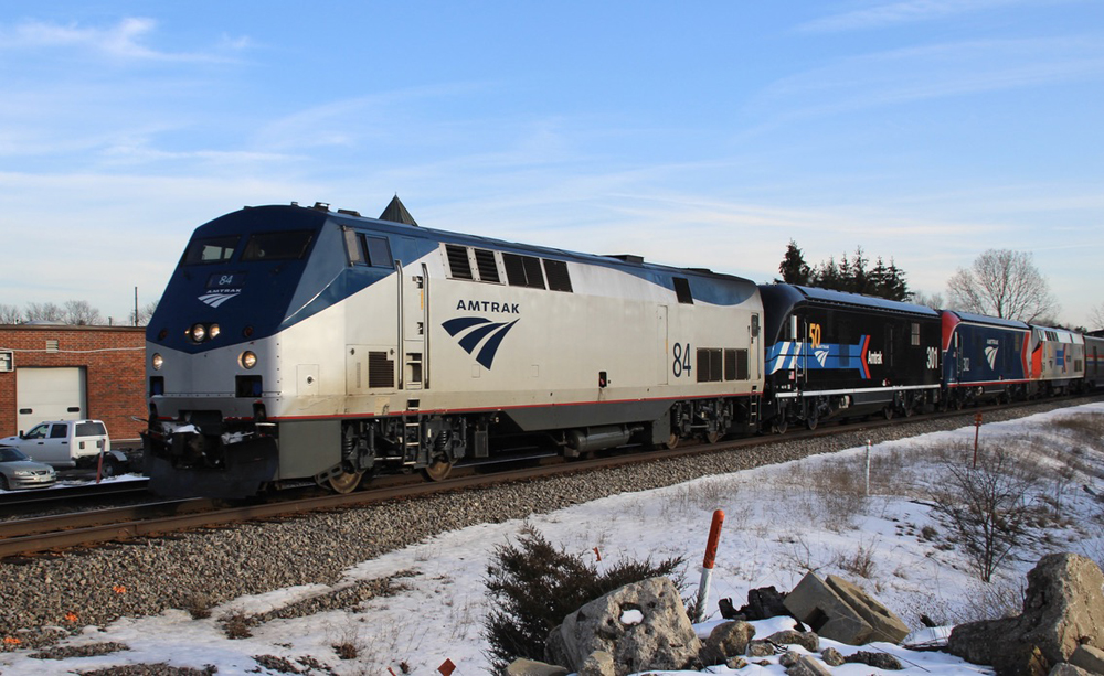 Four locomotives leading passenger train