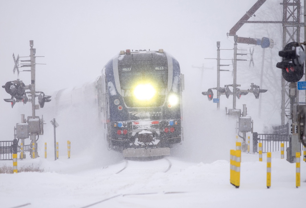 Train approaching in snowstorm