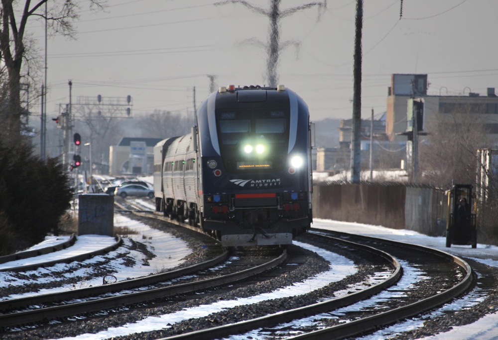 Passenger train approaches curve