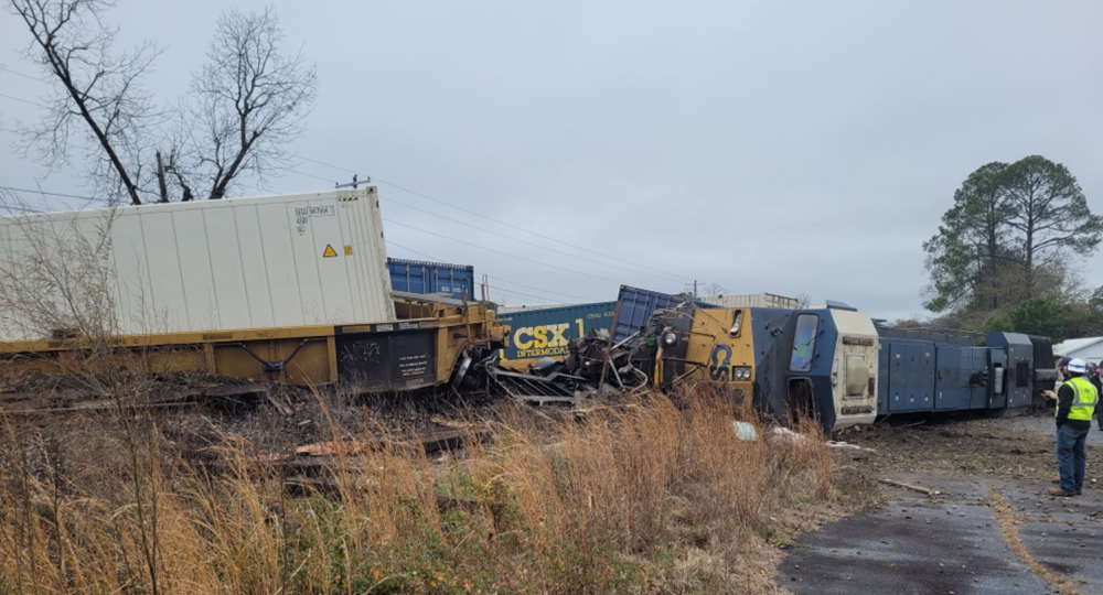 Locomotive on its side and overturned container cars