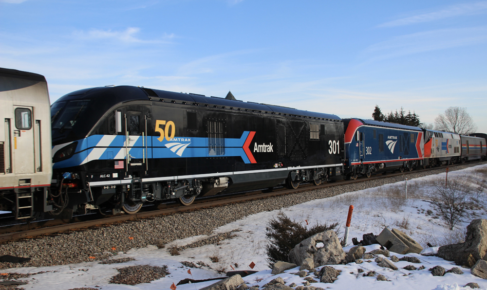 Black, blue, and red and silver locomotives.