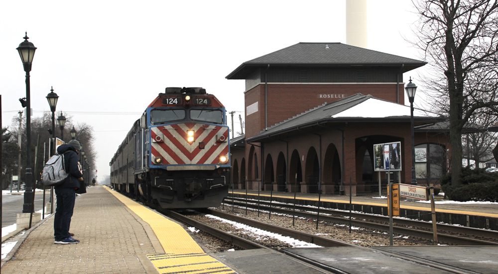 Commuter train arrives at two-story station