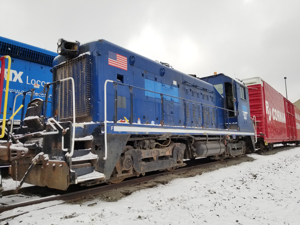 Blue switcher with painted-over company name