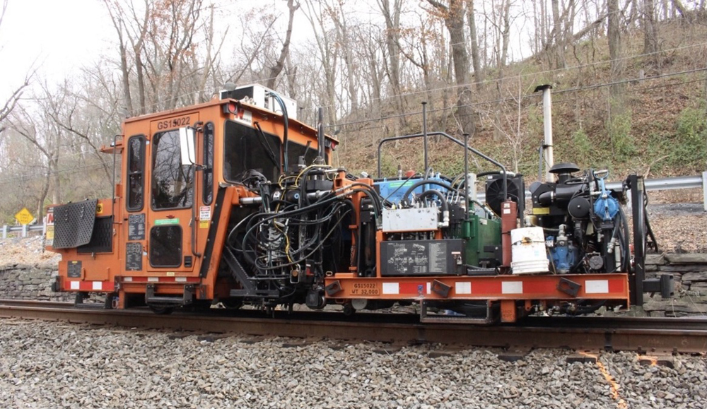 Orange maintenance-of-way machine