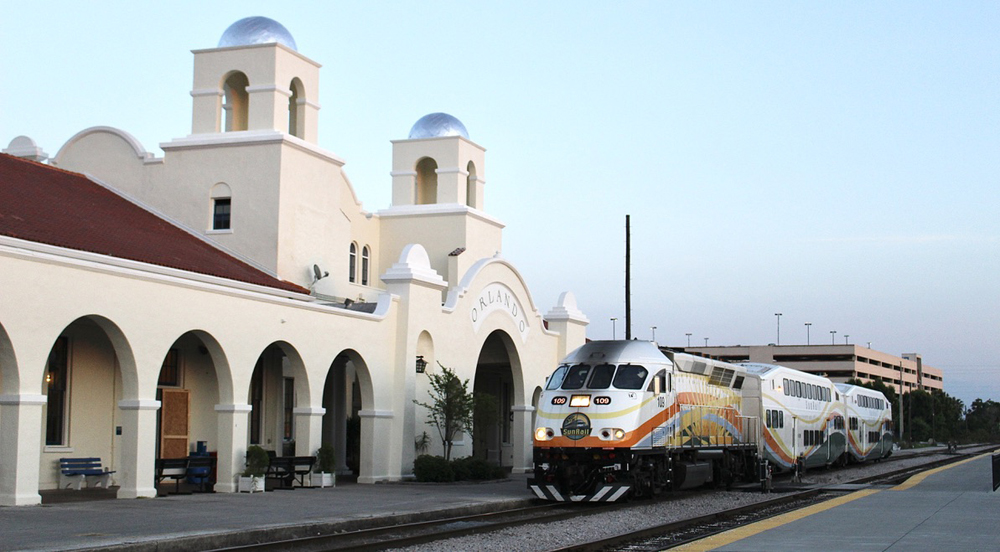 Commuter train at Spanish-style passenger station