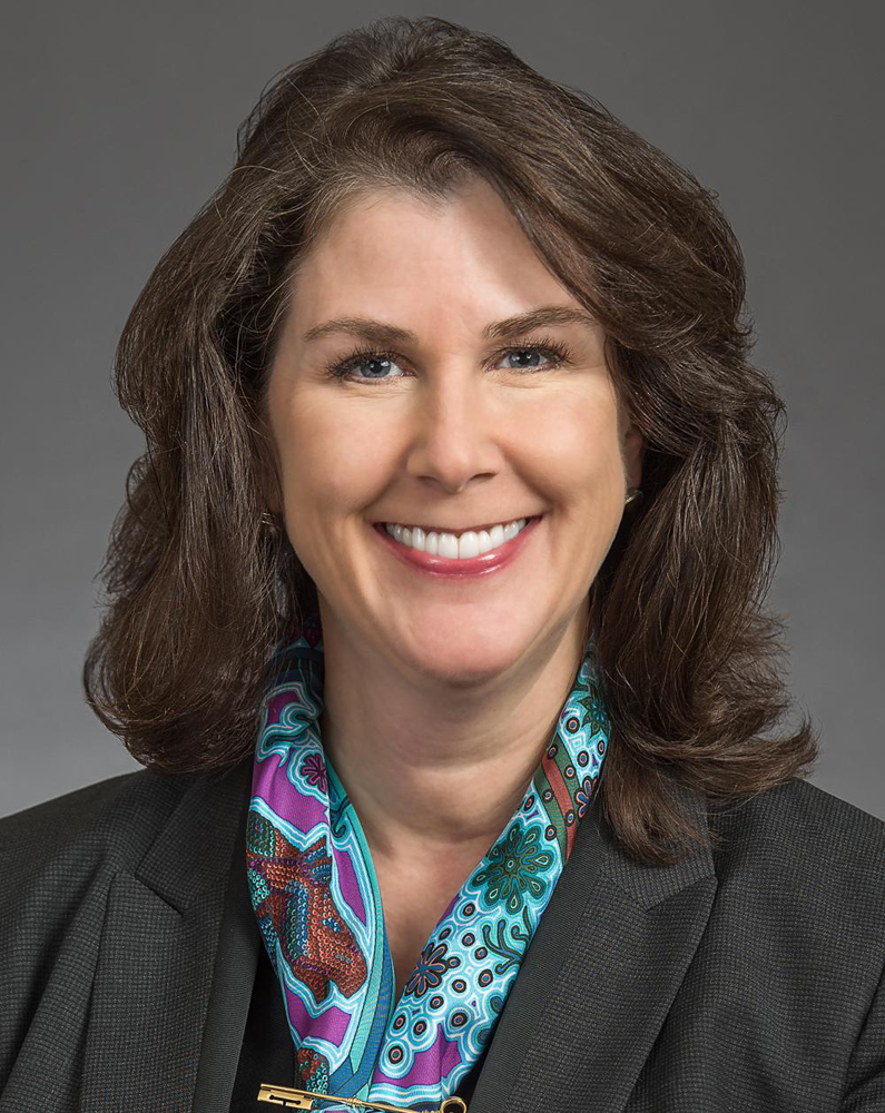 Head-and-shoulders photo of smiling woman