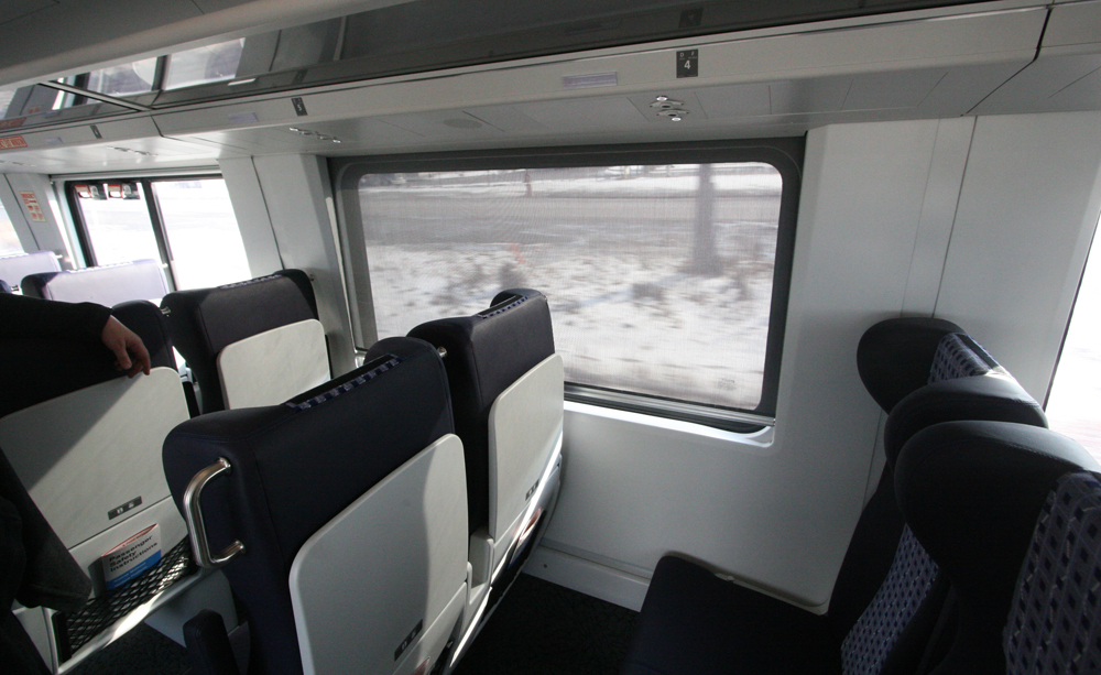 View looking out window of passenger car
