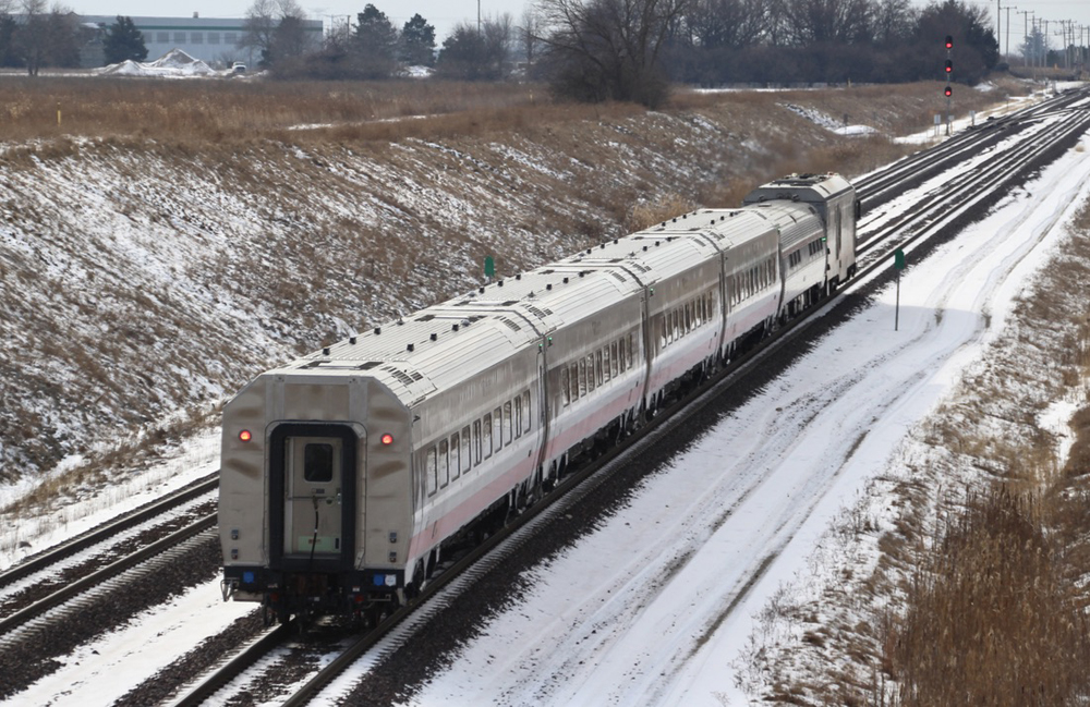 Going-away view of five-car passenger train