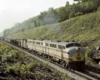 Four-unit streamlined diesel set on freight train in cut