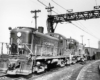 Diesel locomotives with coal train under catenary wires