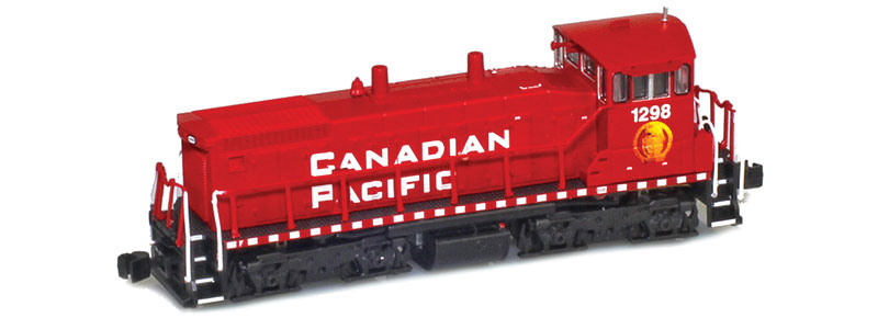 Photo of Z scale end-cab switcher painted red and black with white and gold graphics.