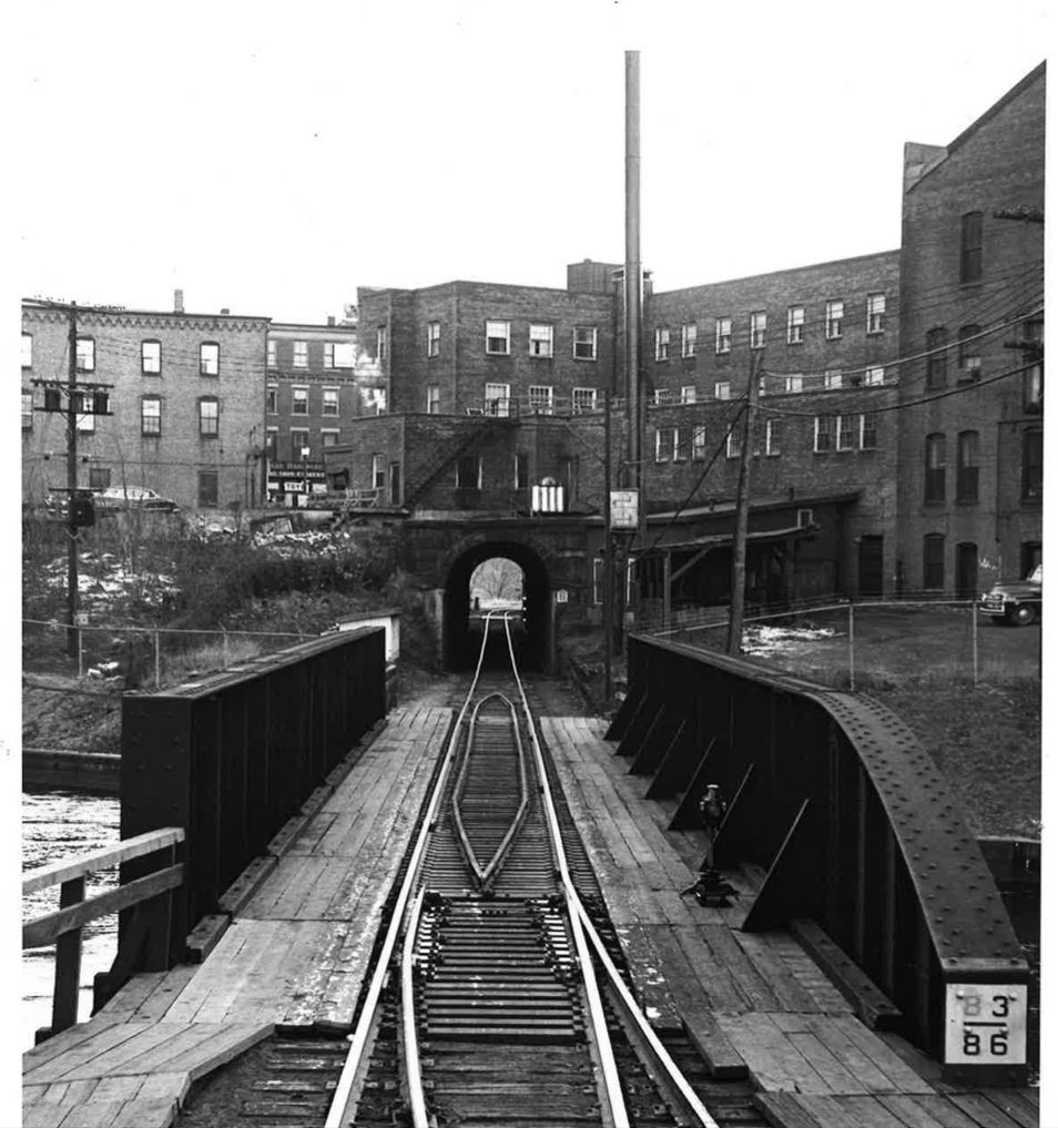 Bellows Falls tunnel under a town prototype: Black and white image showing track tracks underneath a New England town.
